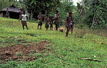 Local children playing in the small village of Matantas, Vanuatu, Pacific Islands. ^^^ Most houses in the village are made of split bamboo and sago palm leaf roofs.