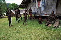 Local children in the small village of Matantas, Vanuatu, Pacific Islands. Most houses in the village are made of split bamboo and sago palm leaf roofs.