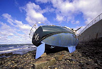 Wrecked yacht washed ashore after a storm, New England, USA