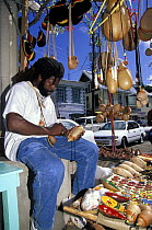 Local man sells souvenirs at a market stall in St Georges, Grenada