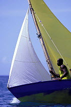 Crew member on the weather rail during the Grenada Saling Festival, Caribbean