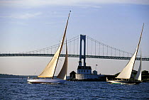 12 metre yachts "Gleam" & "Northern Light" sailing past Rose Island lighthouse, Newport, Rhode Island, USA