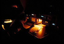 Instrument lights glowing in the navigation station aboard superyacht "Gleam".