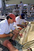 Robbie Doyle of Doyle sails helping with sail repairs aboard the J-Class "Velsheda" during Antigua Classics regatta, Antigua, Caribbean.
