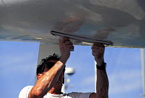 Fairing the hull of a racing yacht to get a smooth hull shape.
