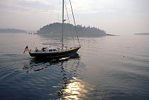 A Hinckley motoring on a calm morning in Maine, USA. Property Released.