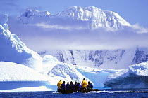 Visitors in a zodiac touring the magnificent scenery of the Antarctic Peninsula.