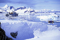 After a tour of the ice, a zodiac transports passengers back to the nearby Russian cruise ship, "Professor Molchanov", Antarctic Peninsula.