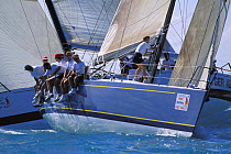 The mastman preparing to hoist the spinnaker at the weather mark during Key West Race Week, Florida, USA, 1999.