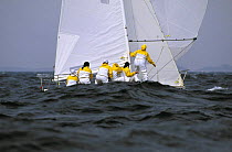 One of the all girl teams sailing downwind off Newport, Rhode Island, USA.