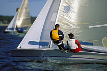 Crew trapezing on a 505 dinghy.