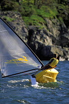 Young boy sailing a plastic roto moulded Escape dinghy. ^^^ These boats are aimed at beginners and provide an inexpensive solution to getting children out on the water.