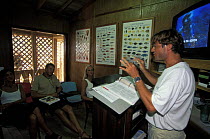 Man giving theory lesson as part of a dive course, Honduras.