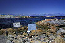 Rocks and signs at Governor Island Marine Reserve, Tasmania, Australia.