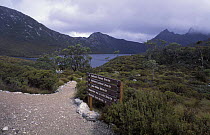 Trekking routes sign in Cradle Mountain National Park, part of the Tasmanian Wilderness World Heritage Area, Tasmania, Australia.