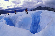 Climbers on top of the Perito Moreno glacier surface where very deep crevasses open up, Los Glaciares National Park, Patagonia, Argentina