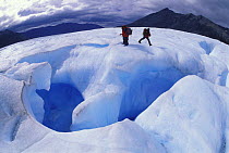 Climbers preparing to explore a crevasse inside the Perito Moreno glacier, Los Glaciares National Park, Patagonia, Argentina