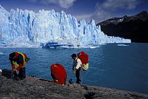 Divers preparing for a dive in Lago Argentino in front of the Perito Moreno glacier, Los Glaciares National Park, Patagonia, Argentina