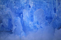 Ice blocks falling from Perito Moreno glacier into Lago Argentino, Los Glaciares National Park, Patagonia, Argentina