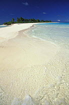 White sandy beach surrounded by clear water, Maldives.