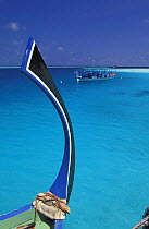 Characteristic bow of dhoni, a traditional Maldivian boat, with another dhoni in background, Maldives.