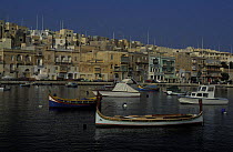 Fishing boats in the harbour that separates Cospicua from Vittoriosa, Malta.