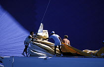 Bowmen work together aboard New Zealand's "K" boat at the America's Cup, 1988.