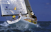 Merit Cup catches a wave as she rounds the windward mark at the SORC, 1999.