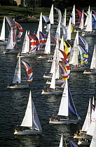 Spinnaker up for a downwind start off the green in Cowes for the Round the Island Race, UK, 1997.