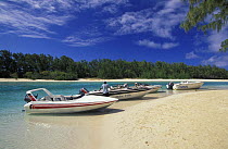 Motorboats pulled up on beach, Mauritius.