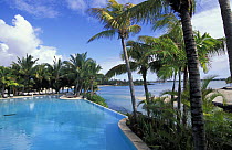 Touessrock hotel swimming pool beside beach, Mauritius.