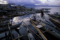 Bangkas moored in front of palafitte village in Puerto Princessa, Palawan, Philippines.