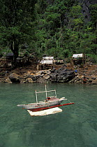 Toy bangka (traditional boat) in the Philippines. Small settlement of people from the Tagbanua tribe, Kayangan Lake, Coron Island in the province of Palawan.