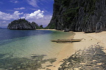 Outrigger canoe on beach close to the tagbanuan tribe settlement on Coron, Palawan, Philippines.