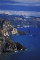 Coastline of Lipari, Aeolian islands, Italy. In the background is Vulcano, smoking.