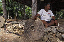 A man with stone money called Rai. Yap, Micronesia. ^^^It has no legal tender on the international currency market but they are still used as legal tender on the islands.