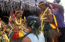 Girls being dressed up for a traditional feast, Yap, Micronesia