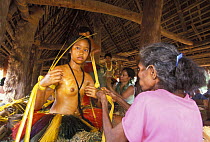 Yapese girl being dressed in traditional costume, Yap, Micronesia