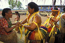 Girls being dressed up for a traditional feast, Yap, Micronesia