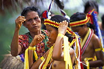 Yapese girl in traditional dress preparing for the dancing at a feast, Yap, Micronesia