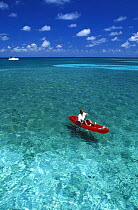 Kayaking in clear waters, Belize. Model and Property Released.