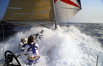 Maxi yacht "Rothmans" buries her bow under spinnaker on a breezy Sydney-Hobart run, 1991.
