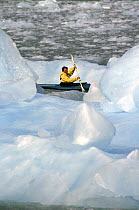 Kayaking though the glacier ice, Alaska.