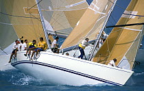 Crew aboard "Juno" prepare the spinnaker pole for the windward mark rounding, Key West Race Week, 1991.