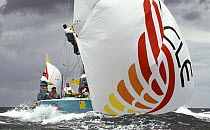 Bowman aboard "Oracle" climbs to the pole end for a spinnaker peel at the Two Ton Cup held, 1991.