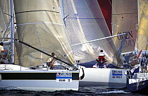 Spinnaker poles are prepared for a windward mark rounding, Admiral's Cup, 1995.