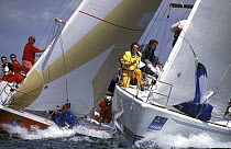 Spinnakers are on the bow ready for the windward mark rounding during the Commodore's Cup, 1996.