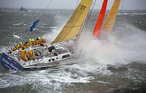 Heavily reefed, "Nuclear Electric" beats out of the Solent at the start of the BT Global Challenge, 1996.