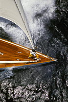 Aerial view of a bowman aboard a classic cruising yacht.