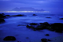Table Mountain high above the lights of Cape Town, South Africa.